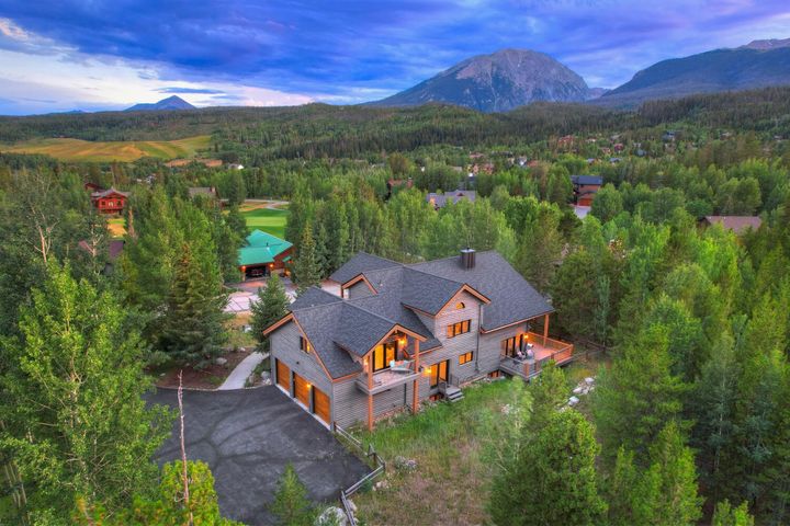 Aerial view of the home and mountain views